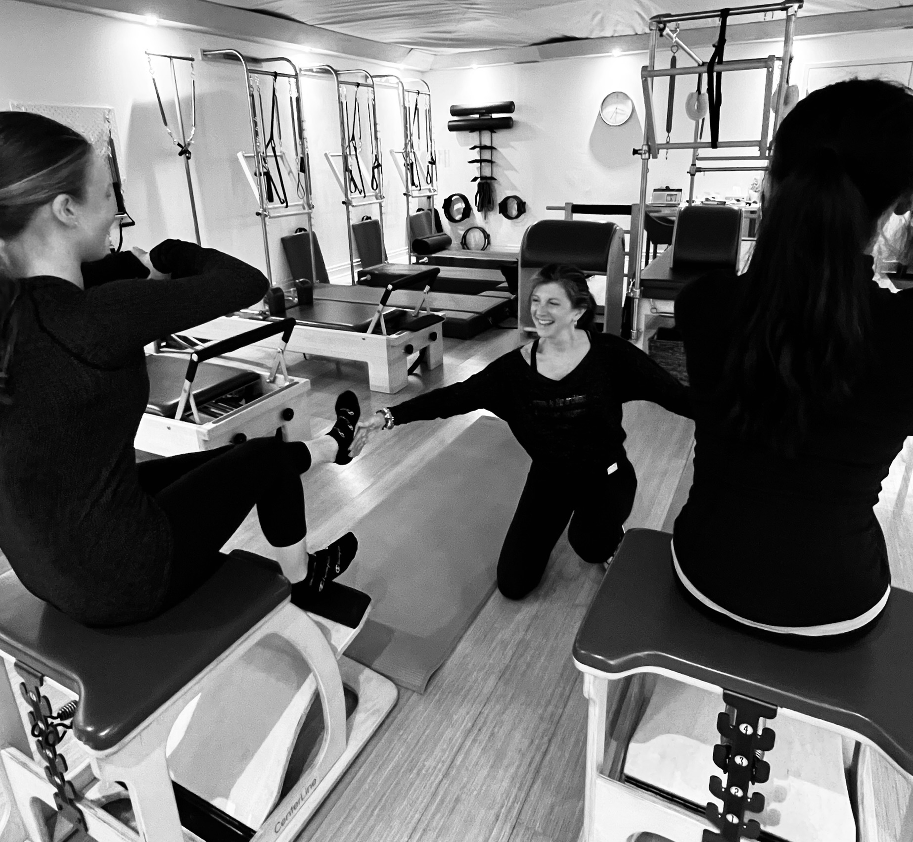Kim, certified Classical Pilates instructor, teaching a private session at Heart of Movement studio in Oakville's Kerr Village